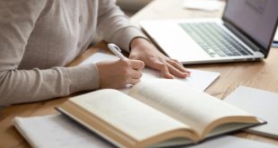 a woman writing content to deliver Coursework Writing Service